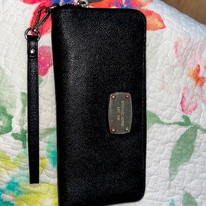 Authentic used Michael Kors wallet in black and silver